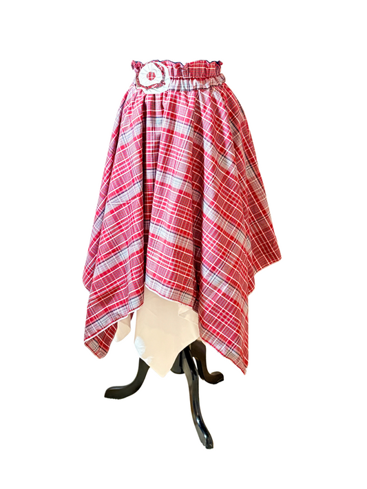 Women’s Jamaican red bandana plaid handkerchief hem circle skirt over a white circle skirt pixie style hem underskirt.