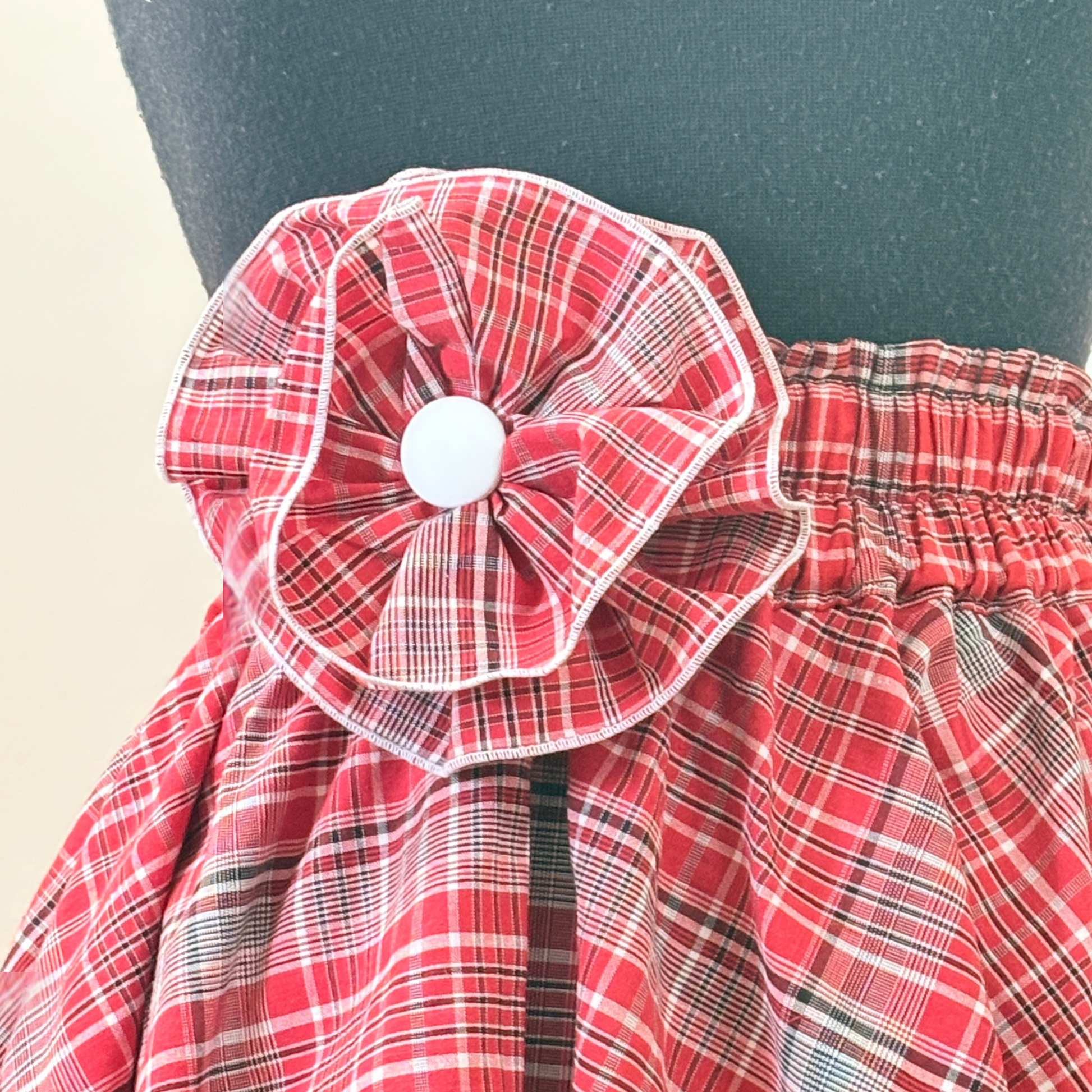 Handmade Jamaican bandana flower with white button center