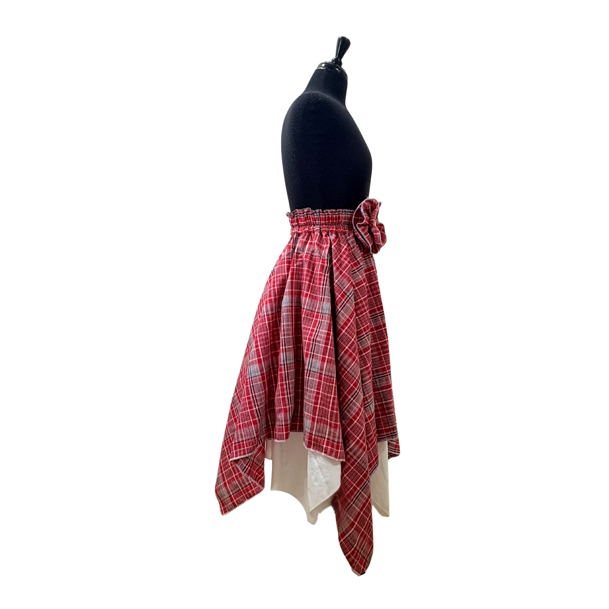 Side view of asymmetrical hem Jamaican bandana red plaid with white reversible skirt.
