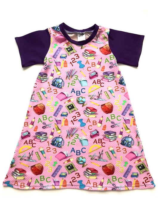 Pink school print A-line dress with purple sleeves