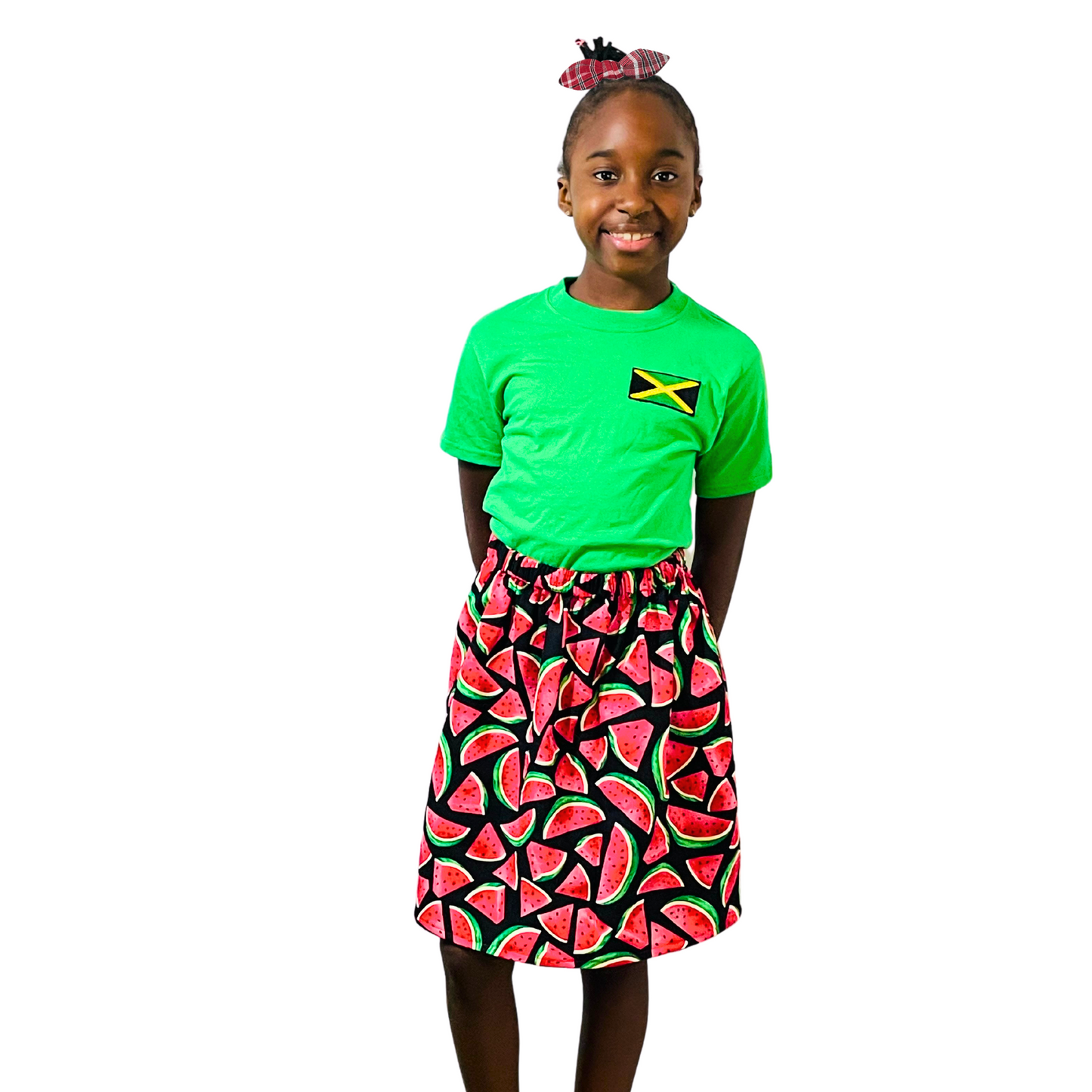 Model is wearing the Jamaican bandana print small knotted bow.