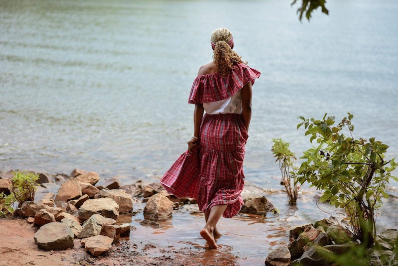 Black lady in Jamaican bandana red plaid skirt set