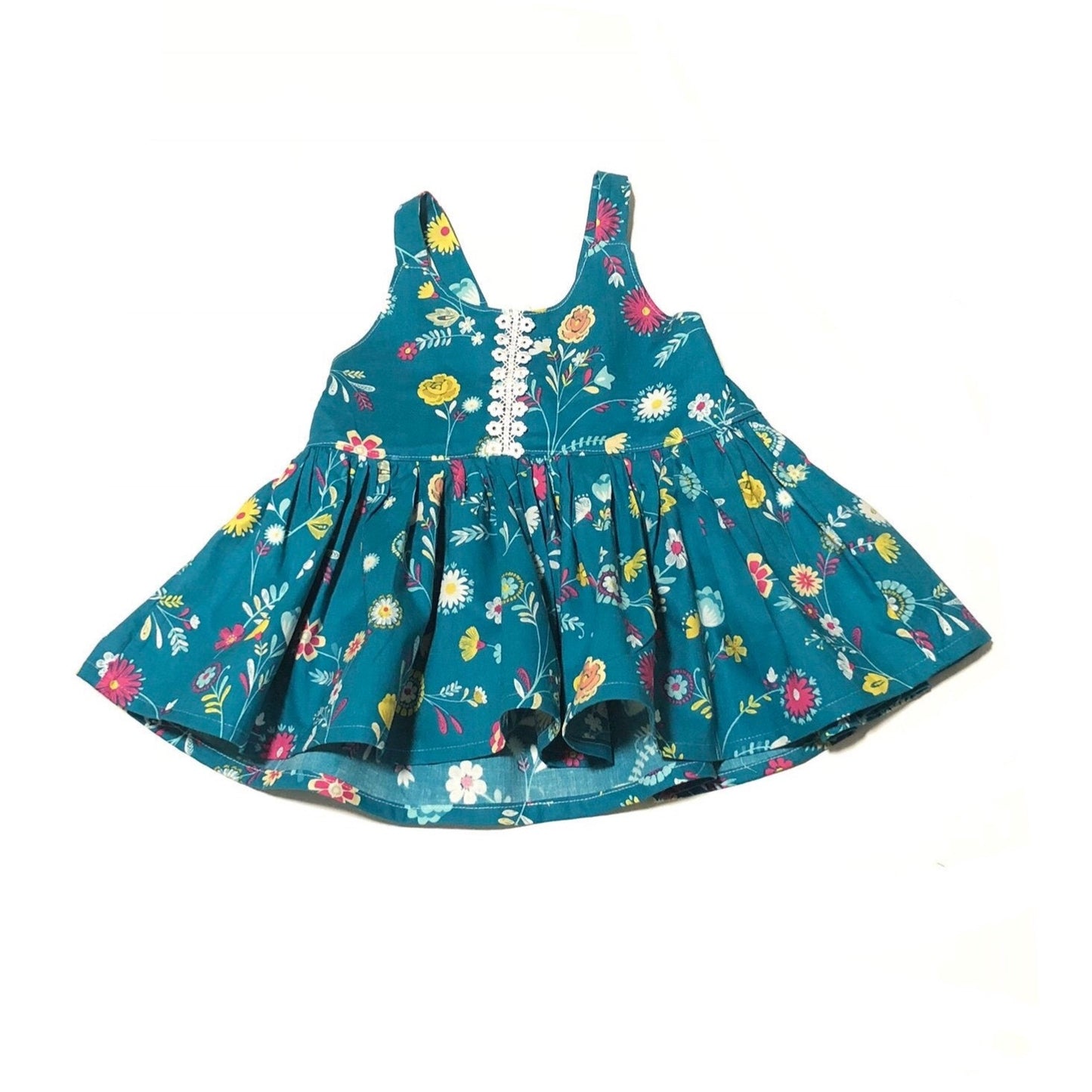 Green floral peplum style top with white lace on the front center vertically arranged from top of neckline to the waist.