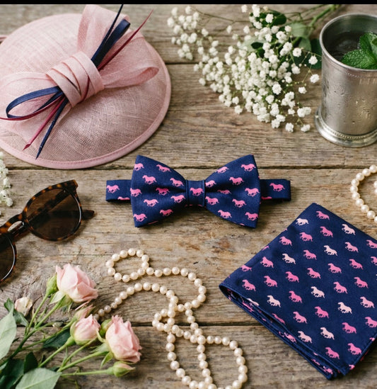 Navy and pink horse print bow tie and pocket square styled with derby fascinator, florals, pearls and mint julep for spring horse racing events and garden party style. Styled inspiration pic and not actual product pics.