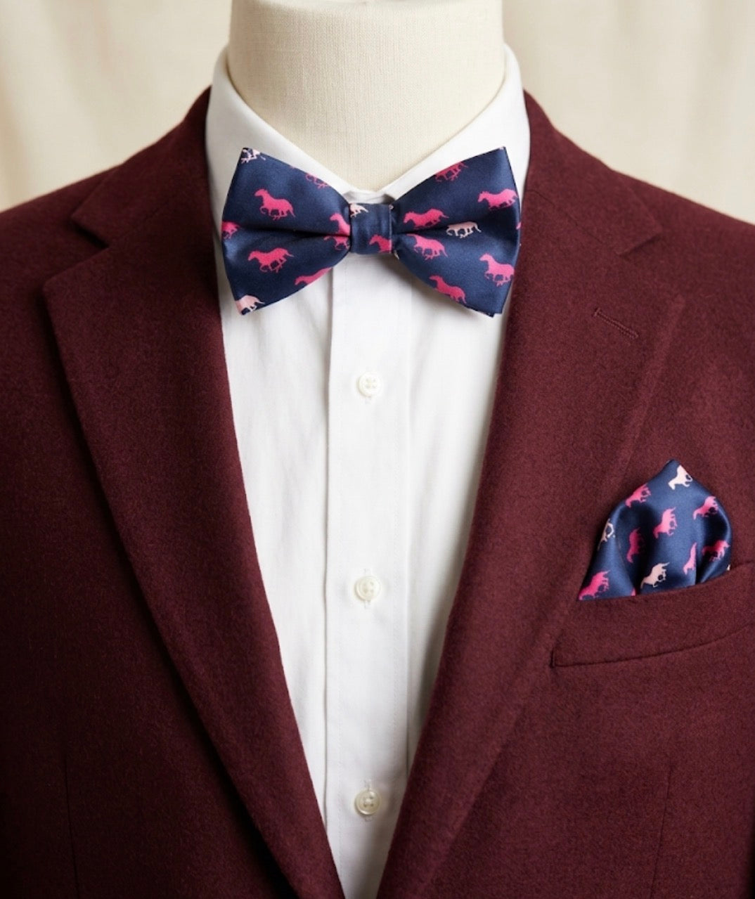 Burgundy blazer with matching navy horse print bow tie and pocket square for Derby menswear styling