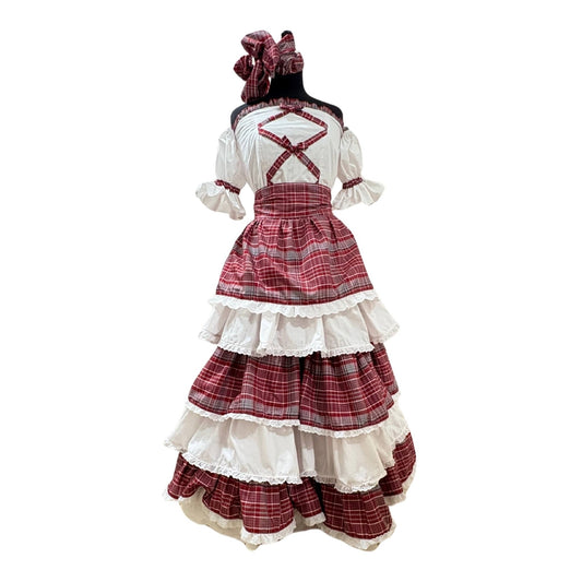 Front view of a 5-tiered white and red plaid Jamaican bandana skirt set, featuring an off-the-shoulder white blouse with bandana design on the front and puff sleeves with elasticated hem and a matching bandana headwrap, displayed on a mannequin.