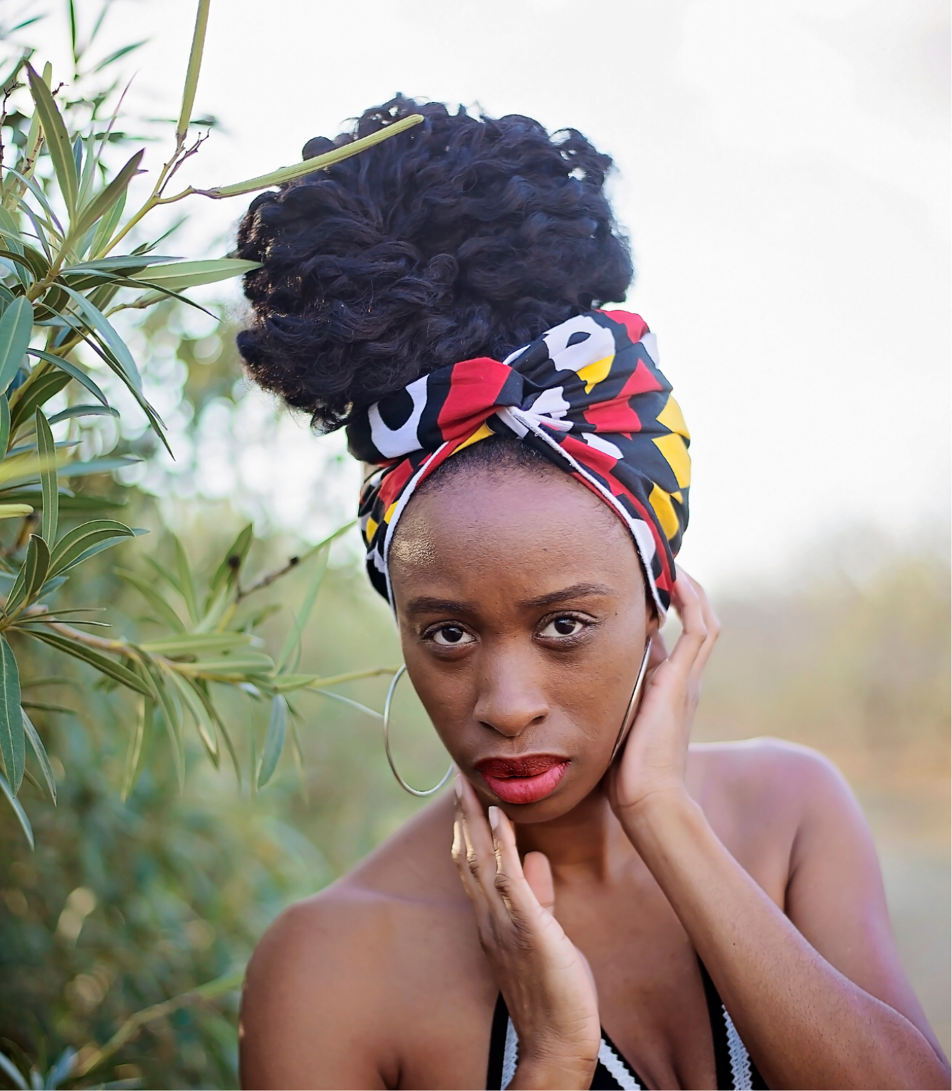 Vibrant red, black, yellow and white Ankara head wrap for natural hair
