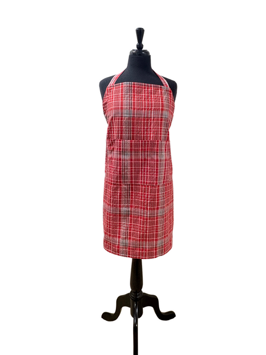 Unisex Jamaican bandana apron in red, blue, and white plaid, featuring an adjustable no-knot neck strap, long waist ties, and three-section pocket. Handmade cultural kitchen apron for cooking, BBQ grilling, or gifting. Sizes Teen/XS to 3XL