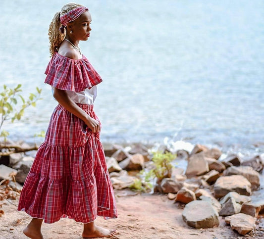 Black lady in Jamaican Bandana red plaid outfit with skirt, blouse and headwrap