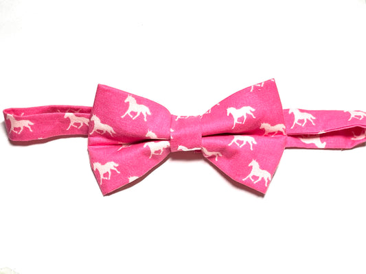 A dark pink self tie bow tie with a horse print, suitable for men's fashion and horse racing events.