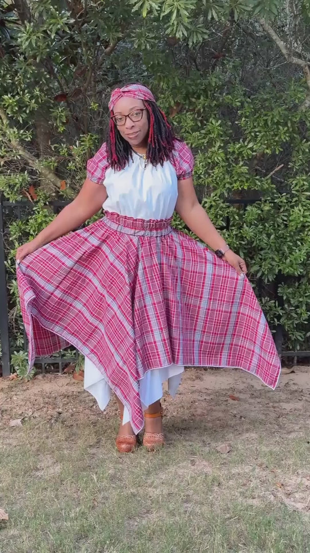 Load video: Jamaican woman wearing and displaying a Jamaican Bandana Skirt Set