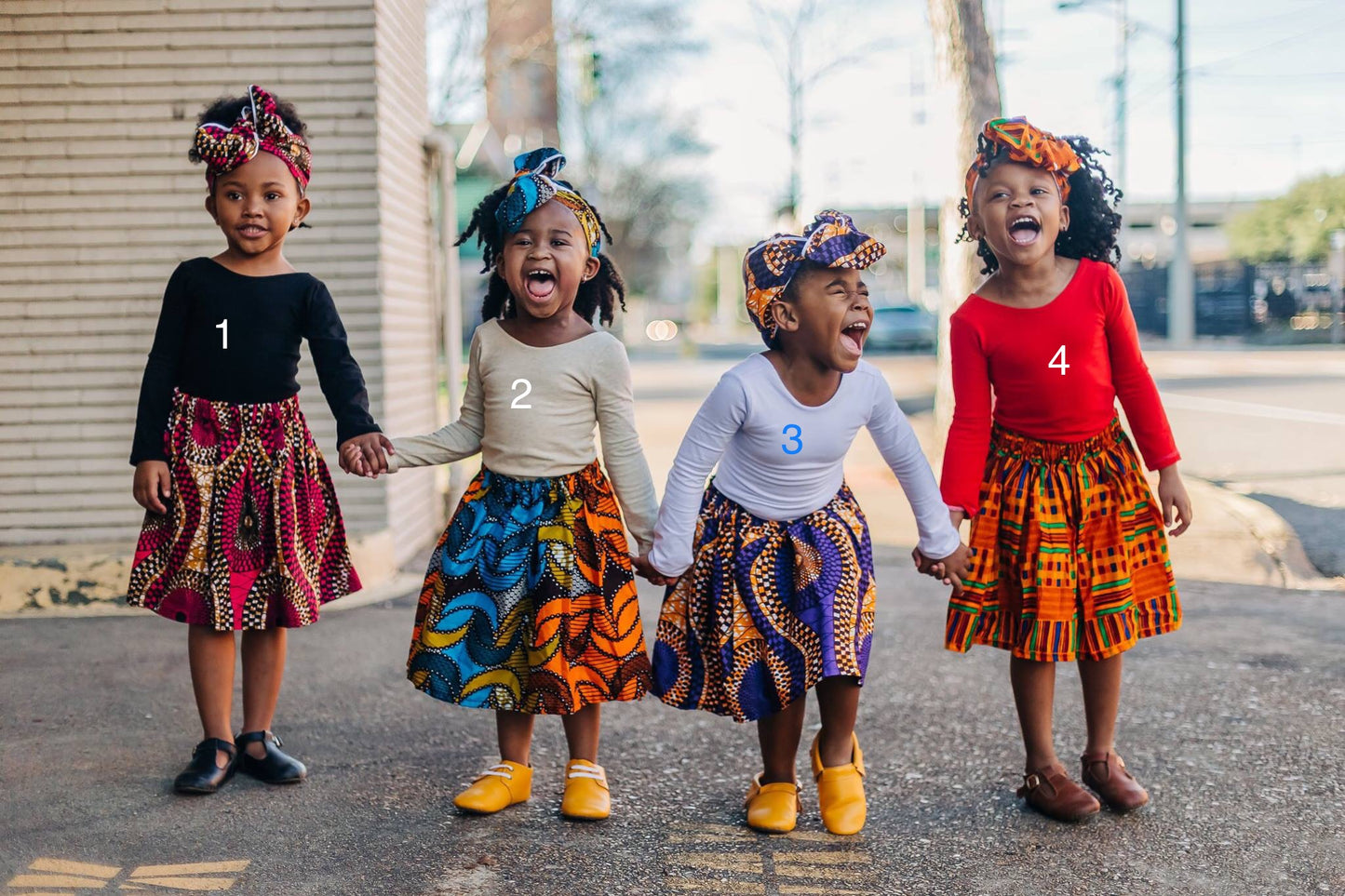 African Print Skirt and Head Wrap. Girl’s modeled different African prints.